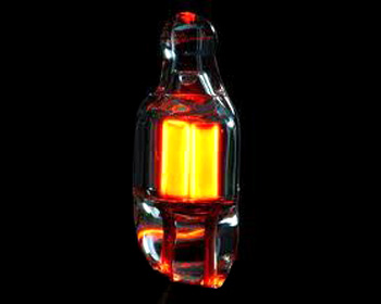 Neon gas glows with an orange-red color in discharge tube