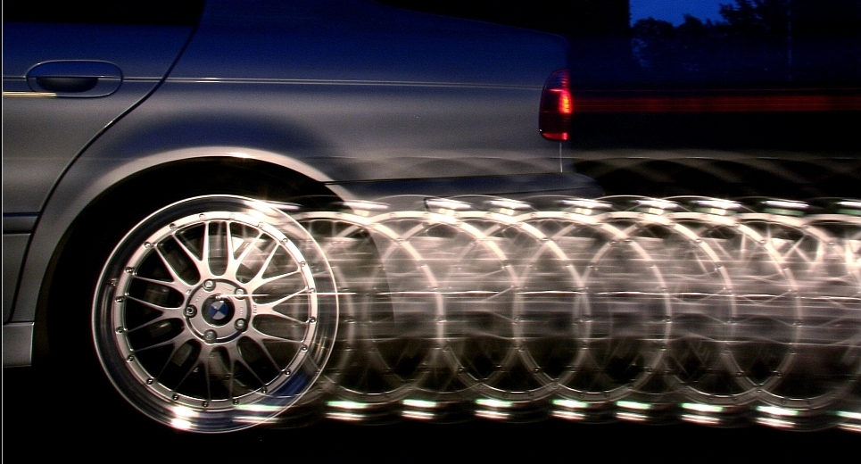A sequence of a photo shoot while a car accelerates: